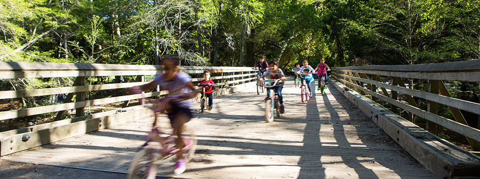 Children playing on the campground bridge